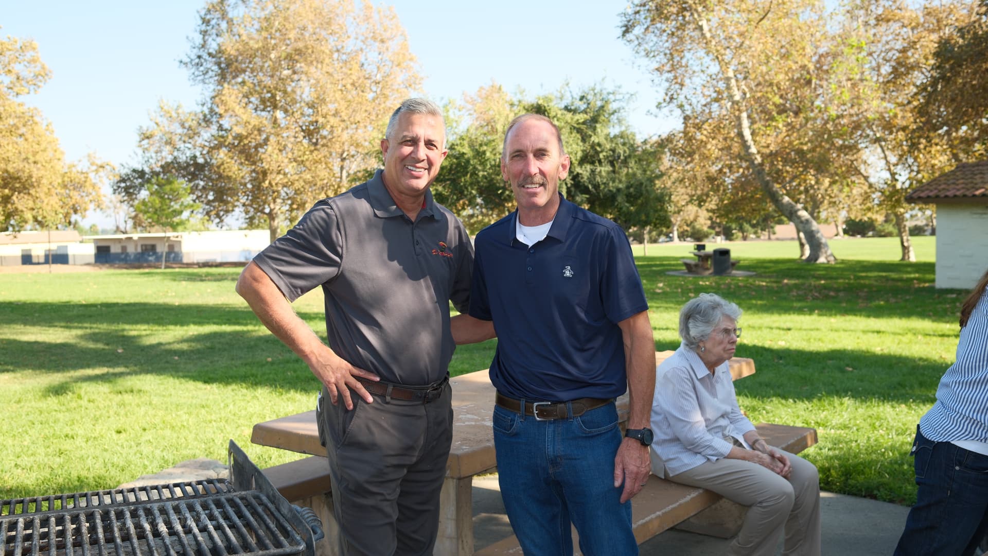 Art Andres with a community leader at a park barbecue