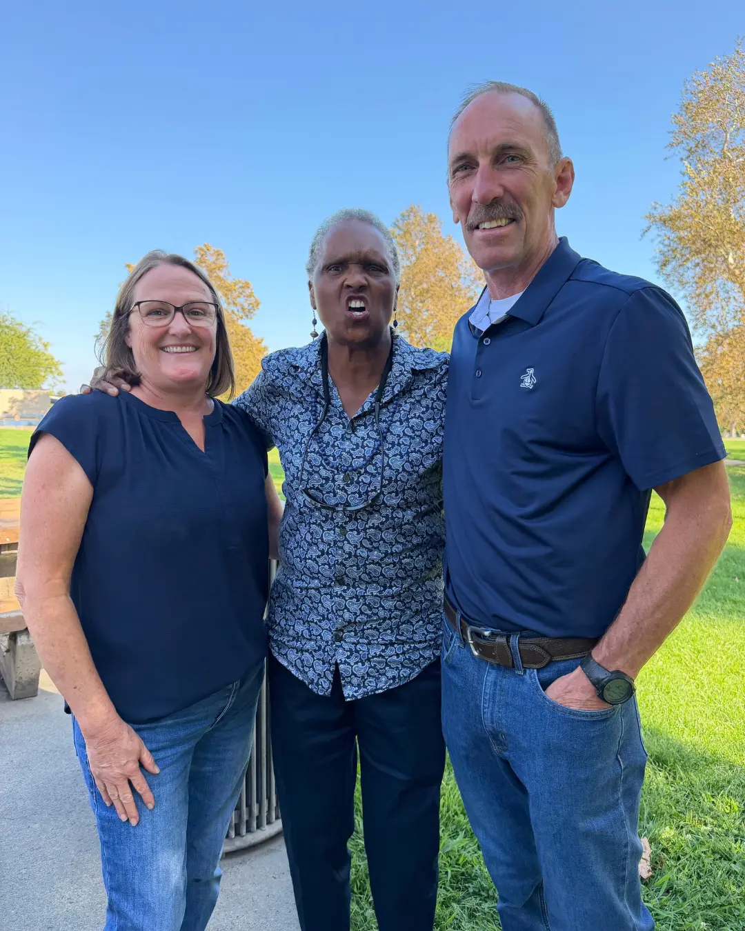 Art Andres with two supporters at a community gathering in a local park