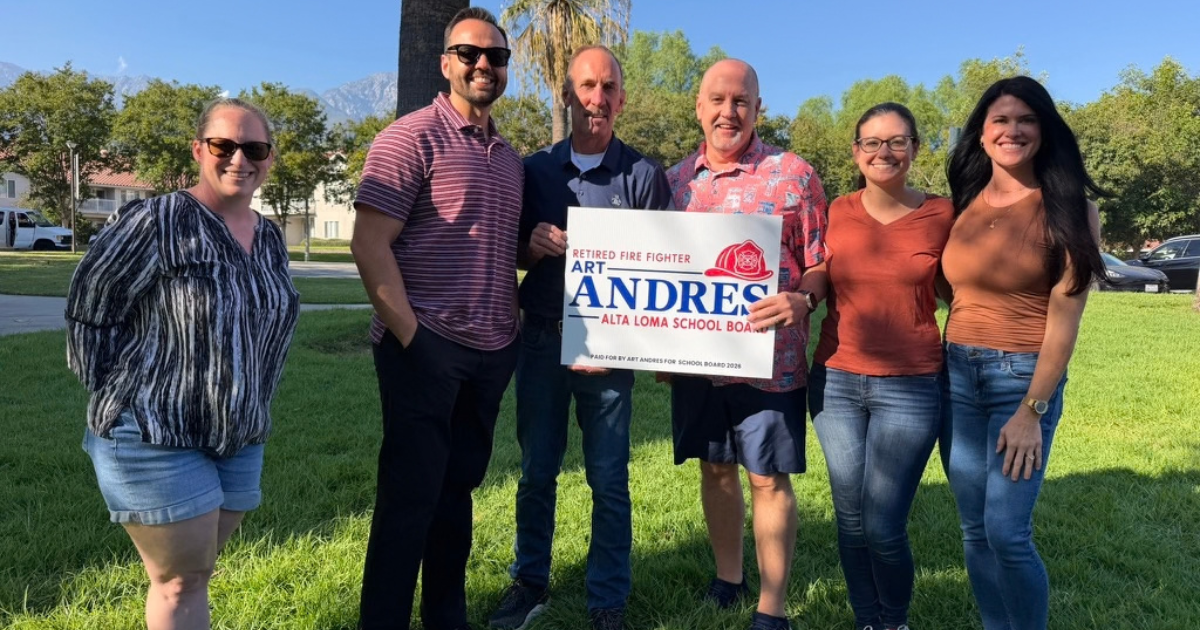 Art Andres with neighborhood supporters holding a campaign sign