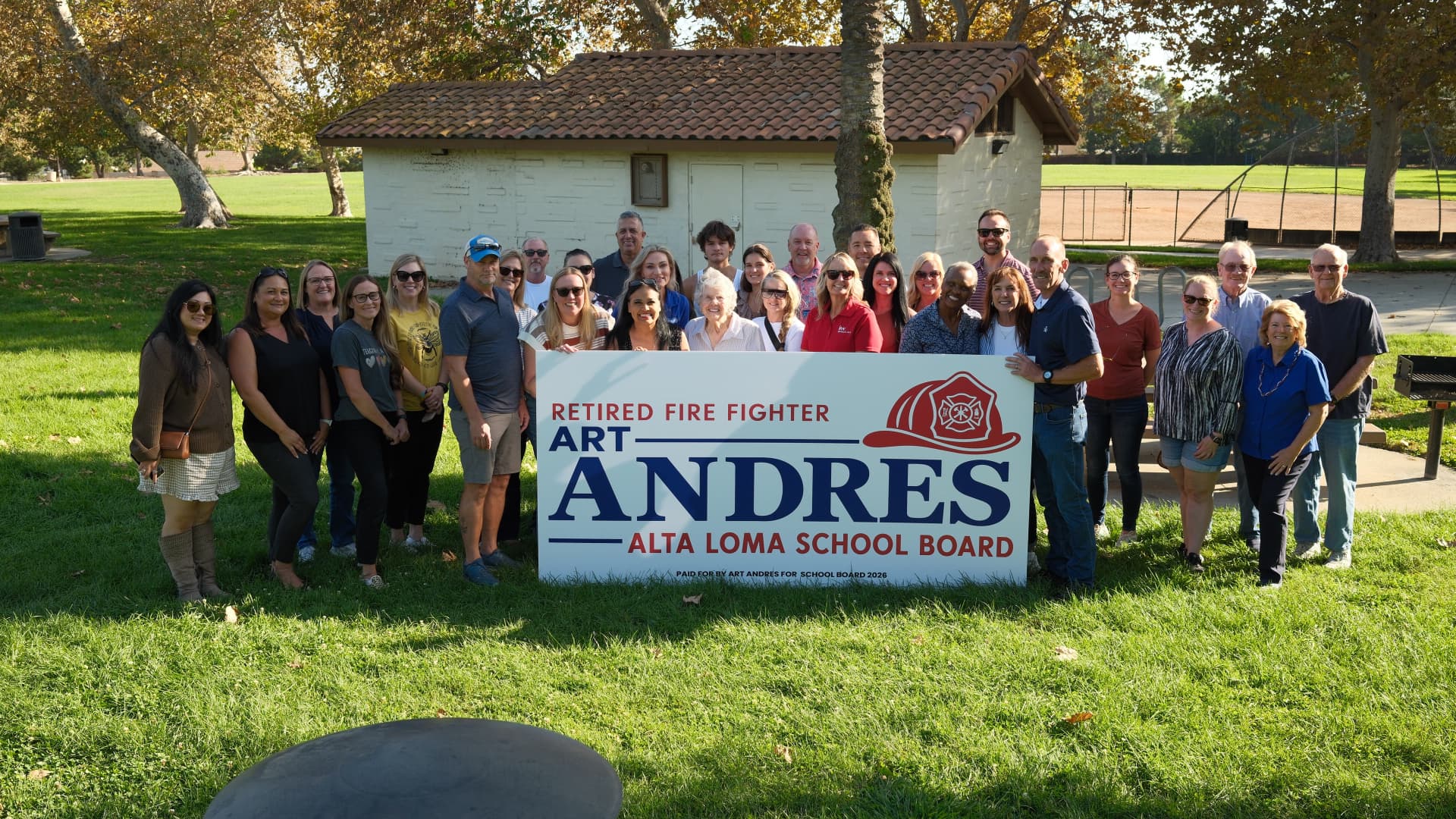 A large group of supporters behind an Art Andres for Alta Loma School Board sign