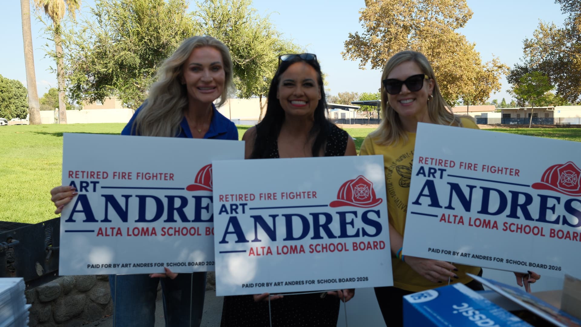 Three volunteers holding Art Andres for Alta Loma School Board signs