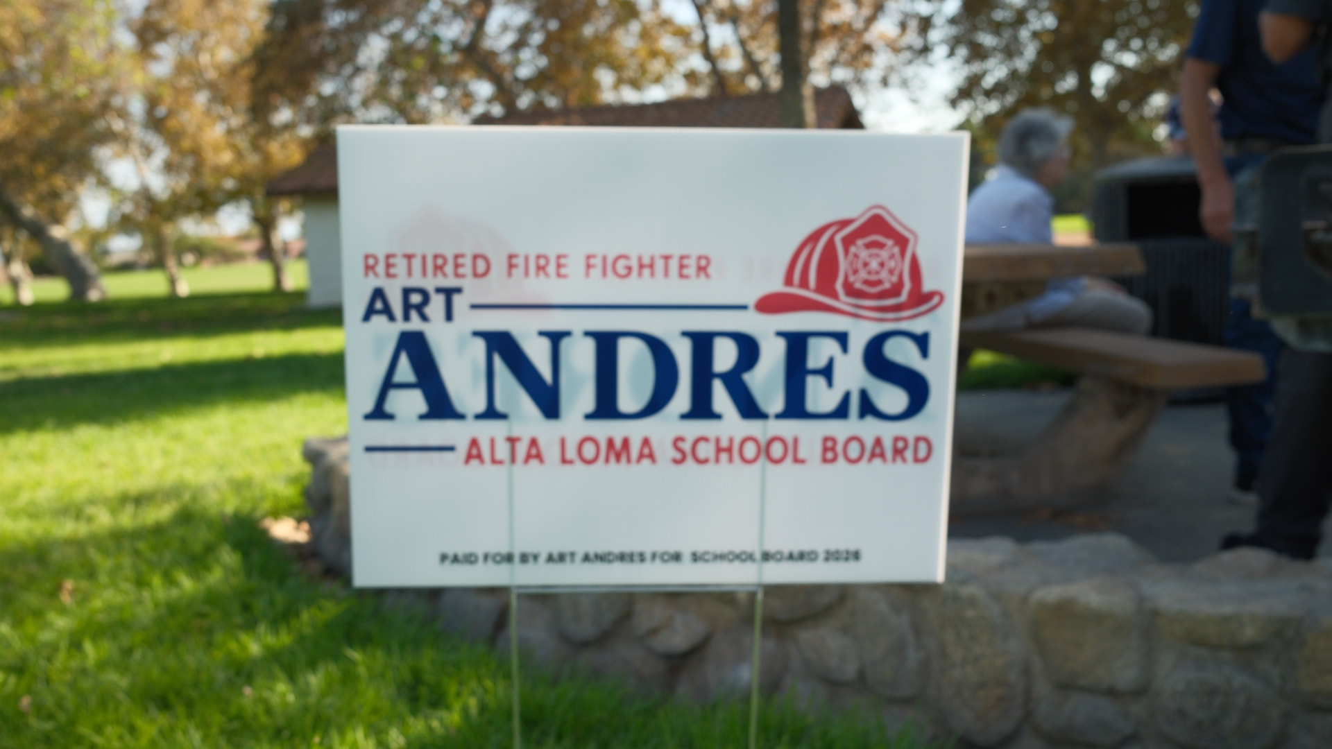 An Art Andres for Alta Loma School Board yard sign at a park gathering